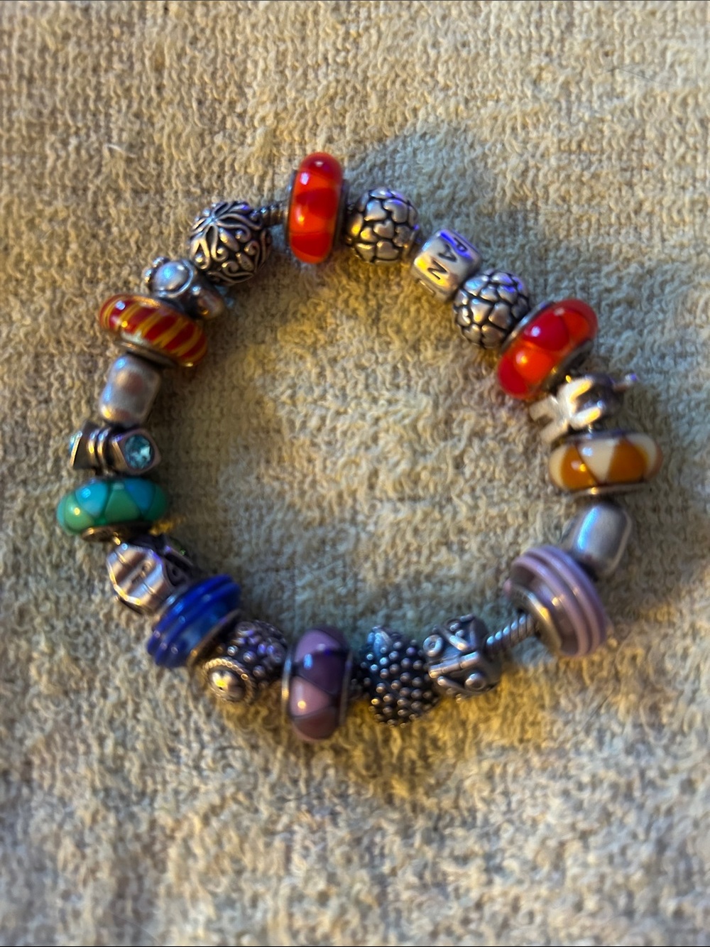 Well kept silver pandora bracelet with 20 charms most are retired.